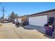 View of multiple detached garages with ample parking space at 3324 N Glencoe St, Denver, CO 80207