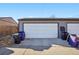 Detached garage with three garage doors and ample space for parking at 3324 N Glencoe St, Denver, CO 80207