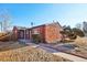 Brick ranch home with a walkway, landscaping, and satellite dish at 3324 N Glencoe St, Denver, CO 80207