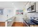 Updated kitchen featuring granite countertops and modern cabinetry at 3324 N Glencoe St, Denver, CO 80207