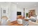 Bright living room with hardwood floors, white walls, and modern furniture at 3324 N Glencoe St, Denver, CO 80207