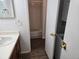 Clean bathroom with a tub and stackable washer/dryer at 14751 E Tennessee Dr # 226, Aurora, CO 80012