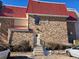 Rear view of the building, showing the brick exterior and red roof at 14751 E Tennessee Dr # 226, Aurora, CO 80012