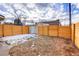 Backyard with wooden fence and detached shed at 2101 S Lafayette St, Denver, CO 80210