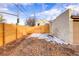 Backyard area with new wood fence and partial view of garage at 2101 S Lafayette St, Denver, CO 80210