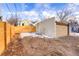 Backyard with detached garage and wooden fence at 2101 S Lafayette St, Denver, CO 80210