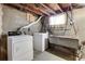 Basement laundry area with washer, dryer, and sink at 2101 S Lafayette St, Denver, CO 80210