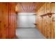 Unfinished basement with wood paneling and shelving at 2101 S Lafayette St, Denver, CO 80210