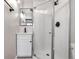 Modern bathroom with white vanity, shower, and white tile at 2101 S Lafayette St, Denver, CO 80210