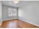 Bright bedroom with hardwood floors and two windows at 2101 S Lafayette St, Denver, CO 80210