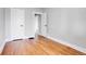 Well-lit bedroom featuring hardwood floors and neutral-toned walls at 2101 S Lafayette St, Denver, CO 80210