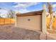 Tan garage door with gravel driveway at 2101 S Lafayette St, Denver, CO 80210