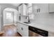 Stylish kitchen with white cabinets, quartz countertops, and stainless steel dishwasher at 2101 S Lafayette St, Denver, CO 80210