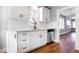 Renovated kitchen with white shaker cabinets, quartz countertops, and stainless steel appliances at 2101 S Lafayette St, Denver, CO 80210