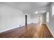 Bright living room featuring hardwood floors and an arched entryway at 2101 S Lafayette St, Denver, CO 80210