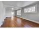 Hardwood floors and large windows are featured in this living room at 2101 S Lafayette St, Denver, CO 80210