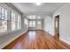 Living room with hardwood floors and multiple windows providing natural light at 2101 S Lafayette St, Denver, CO 80210
