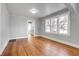 Hardwood floors and a view into the kitchen from this living room at 2101 S Lafayette St, Denver, CO 80210