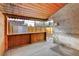 Covered patio with wooden walls and backyard view at 2101 S Lafayette St, Denver, CO 80210