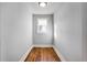 Small bedroom with hardwood floors and a single window at 2101 S Lafayette St, Denver, CO 80210