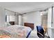 Main bedroom with mirrored closet doors and en-suite bathroom at 1020 15Th St # 27E, Denver, CO 80202