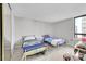 Bright bedroom with two twin beds and city view at 1020 15Th St # 27E, Denver, CO 80202