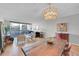 Elegant dining room showcasing a rustic wood table and modern chandelier at 1020 15Th St # 27E, Denver, CO 80202