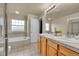 Bathroom featuring double sinks, a soaking tub, and a glass shower at 22801 E Briarwood Pl, Aurora, CO 80016