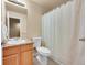 Bathroom featuring a vanity sink, toilet, and shower with a curtain at 22801 E Briarwood Pl, Aurora, CO 80016