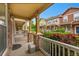 View from porch, featuring stone accents, townhomes, and landscaped front yards at 22801 E Briarwood Pl, Aurora, CO 80016