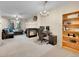 Spacious living area with fireplace, desk, hardwood floors, and natural light at 22801 E Briarwood Pl, Aurora, CO 80016
