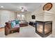 Bright living room features a fireplace, large sectional, and neutral tones at 22801 E Briarwood Pl, Aurora, CO 80016