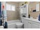 Bathroom featuring shower over tub with rainfall showerhead, vanity, and medicine cabinet at 3667 Hudson St, Denver, CO 80207