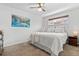 Bright bedroom with neutral carpet, double-hung windows, and closet at 3667 Hudson St, Denver, CO 80207