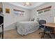 Bedroom with neutral carpet, double-hung windows, closet, and desk at 3667 Hudson St, Denver, CO 80207