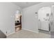 Bright dining area with arched doorways leading to the living room and laundry areas at 3667 Hudson St, Denver, CO 80207