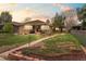 Charming brick home with landscaped front yard and walkway at 3667 Hudson St, Denver, CO 80207