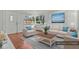 Bright living room with ample natural light, neutral decor, and contemporary furnishings at 3667 Hudson St, Denver, CO 80207