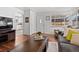 Cozy living room with hardwood floors, natural light, comfortable seating, and front entry at 3667 Hudson St, Denver, CO 80207