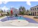 Outdoor playground with modern climbing structures, slides, and safety surfacing for to enjoy at 3667 Hudson St, Denver, CO 80207