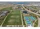 Aerial view showcasing the community park featuring athletic fields and tennis courts at 9763 Cove Creek Dr, Highlands Ranch, CO 80129