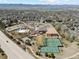 Aerial view showcasing the community recreation center featuring a pool, playground, and tennis courts at 9763 Cove Creek Dr, Highlands Ranch, CO 80129