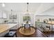Cozy dining area adjacent to kitchen, perfect for casual meals, with backyard access at 9763 Cove Creek Dr, Highlands Ranch, CO 80129