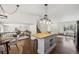 Open-concept kitchen with butcher block island, perfect for entertaining and Gathering gatherings at 9763 Cove Creek Dr, Highlands Ranch, CO 80129