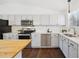 Modern kitchen featuring white cabinets, subway tile backsplash, and stainless appliances at 9763 Cove Creek Dr, Highlands Ranch, CO 80129