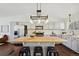 Well-appointed kitchen with a large butcher block island and stainless steel appliances at 9763 Cove Creek Dr, Highlands Ranch, CO 80129