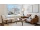 Bright living room featuring modern decor, comfortable seating, and a large window with natural light at 9763 Cove Creek Dr, Highlands Ranch, CO 80129