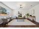 Bright and airy living room featuring contemporary furniture and large windows for natural light at 9763 Cove Creek Dr, Highlands Ranch, CO 80129