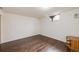 Finished basement room with laminate flooring and neutral walls at 1441 E 84Th Pl, Denver, CO 80229