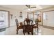 Bright dining area with wood table and chairs, near sliding door at 1441 E 84Th Pl, Denver, CO 80229